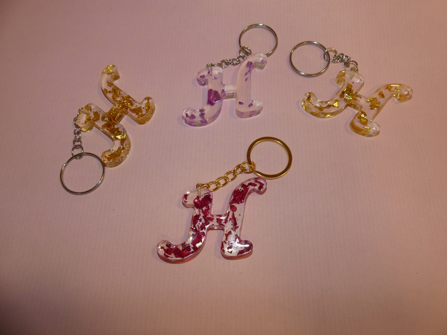 Porte-clefs Alphabet H transparent/feuilles d'or violettes